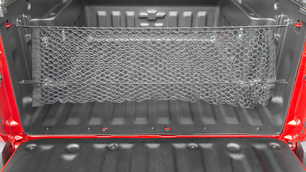 Organiza tu caja de carga con la red vertical para Chevrolet Montana 2025